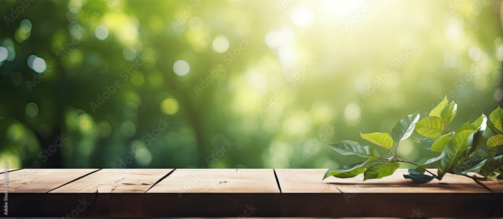 Poster a wooden table with a blurred background of trees on a farm is available for displaying or montaging