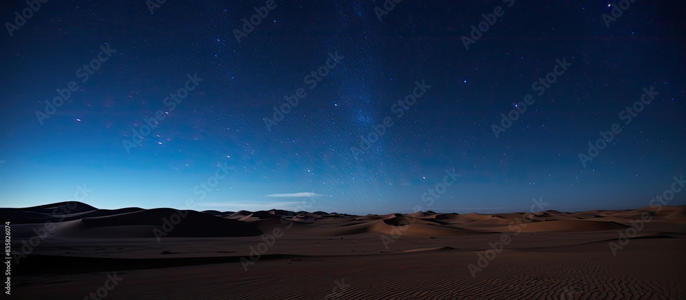 Canvas Prints nightly desert hills and dunes under a starry sky with clouds in blue hues, ideal for a photo with c