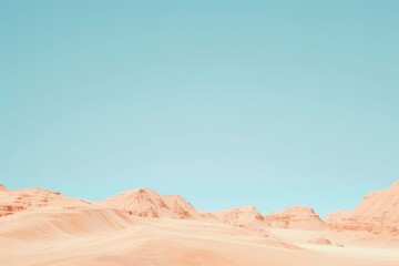 Naklejka premium Majestic desert landscape under clear blue sky with sandy dunes and rocky mountains