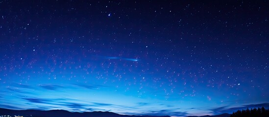 Andromeda galaxy in the night sky with a meteor shower during the Perseid event; a stunning celestial view with a vast expanse and a copy space image included.