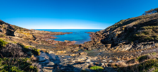Fototapeta premium Panoramic view of the beautiful cove at low tide on Mount Jaizkibel next to San Sebastian, Gipuzkoa, Basque Country