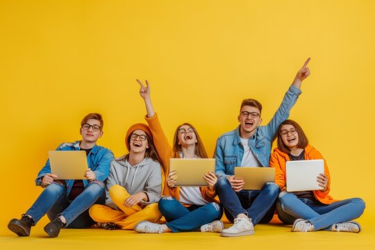 A group of joyful friends celebrate together with laptops on a sunny yellow background, embodying teamwork, enthusiasm, and happiness. The scene reflects a vibrant and connected community