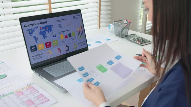 Asia people expert woman AI deep tech talent working on project predict sales insight SEO graph chart plan visual big data science report center BI smart tools screen. Office worker asian analyst job.