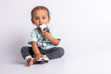 child playing with car. little boy playing miniature car. Joyful baby playing with toys. baby boy smiling with friction cars.