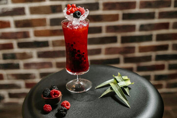 Refreshing Berry Drink With Ice on Table