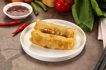 Vietnamese stuffed spring roll served sauce