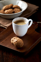 Cup of coffee on wooden background. Close up.