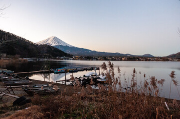 Mount Fuji on a bright winter morning, as seen from across lake Kawaguchi, and the nearby town of Kawaguchiko.