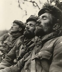 Three soldiers sleeping in the woods