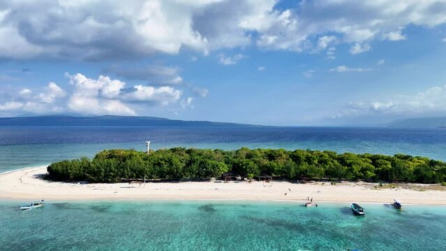 drone aerial view of uninhabited island with beautiful views, blue sea and white sand, tabuhan island banyuwangi east java indonesia.
