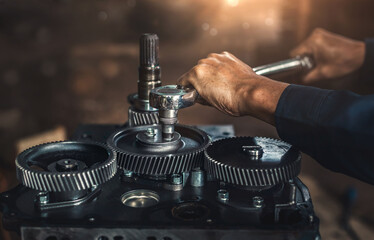 Car spare parts.The cylinder head of an internal combustion engine. Close-up of the mechanic's...