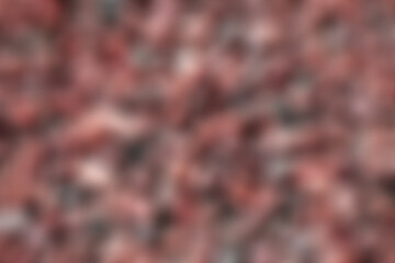 Blurred Abstract scene of red color Rock or mini Stone on the Ground Texture Background  