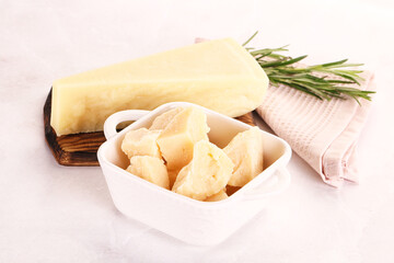 Chopped Italian hard parmesan cheese