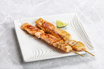 Grilled salmon skewer with sauce