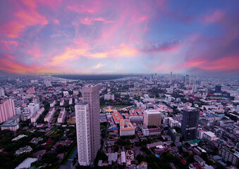 Fototapeta premium Sunset in megalopolis. Beautiful cityscape with top view on skyscrapers. Bangkok, Thailand.