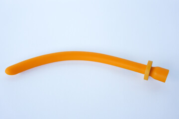 nasopharyngeal airway tube isolated on white. NPA maintains airway patency in spontaneously...