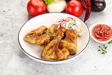 Grilled chicken wings with sauce