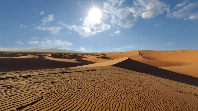 vertical shot of peaceful desert under clear blue sky taken in Morocco. seamless looping overlay 4k virtual video animation background