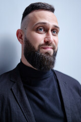 Obraz premium Studio portrait of young handsome man with beard.