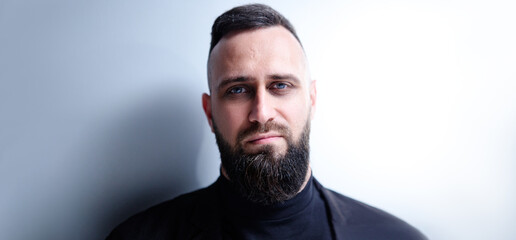 Obraz premium Studio portrait of young handsome man with beard.