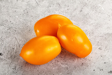 Ripe juicy yellow tomato heap