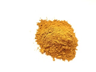 Cinnamon powder on a bright background.