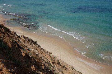 Mediterranean sea in spring.  Deserted shorekurkar sandstone cliff nature reserve, high above the Mediterranean sea coastline between Herzliya and Netanya towns, Israel.
