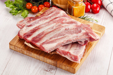 Fototapeta premium Raw pork ribs over board