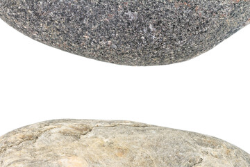 Edges of two pebbles isolated on white background