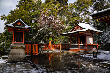 Fototapeta premium Ancient traditional Japanese gateway and temples at Fushimi Inari Shrine in Kyoto Japan.