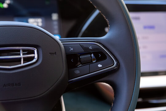 Novosibirsk, Russia -  May 15, 2024:  Geely Monjaro, Close up of car steering wheel with function buttons