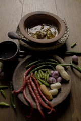 Indonesian food is placed along with its ingredients and spices