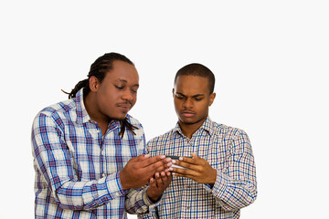 Two serious confused looking men watching something on cellphone  