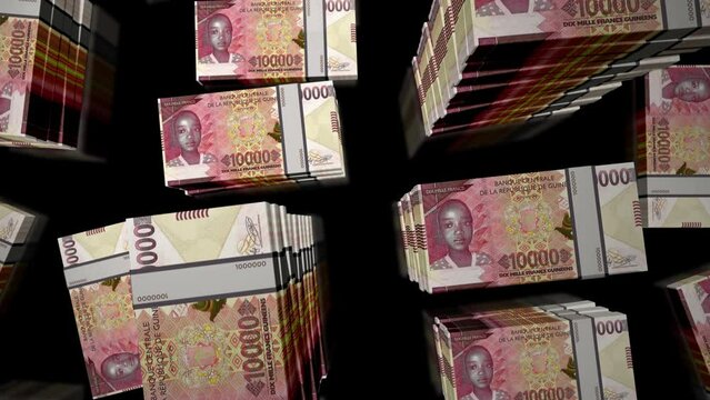 Guinea money Guinean francs notes packs loop. 3D flight over GNF 10000 banknotes stacks towers. Loopable seamless abstract background concept of business, economy crisis and finance.