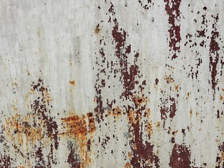 abstract background texture.The surface of the rusted steel.orange and white color on material.Weathered old zinc fence.