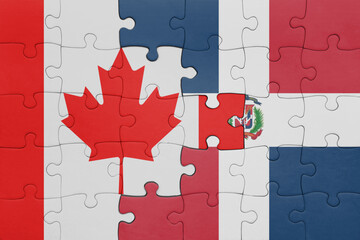 puzzle with the colourful national flag of dominican republic and flag of canada.