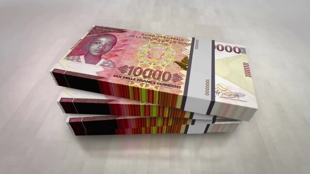Guinea money Guinean francs pile pack. Concept background of economy, banking, business, crisis, recession, debt and finance. GNF 10000 banknotes stacks 3d.