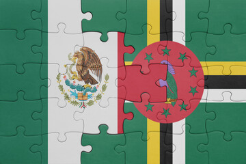 puzzle with the colourful national flag of dominica and flag of mexico .