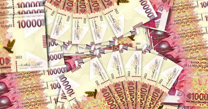 Guinea money Guinean francs banknotes in a cash fan mosaic pattern loop. GNF 10000 notes. Abstract concept of bank, finance, economy seamless and looped design background.