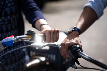 summer holidays, bikes, love, relationship and dating concept - closeup of woman hand holding coffee and riding bicycle