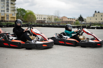 Children Enjoying Go-Kart Racing Outdoors for a Fun and Exciting Adventure
