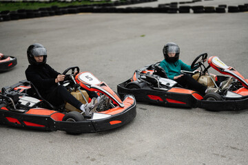 Children Enjoying Go-Kart Racing Outdoors for a Fun and Exciting Adventure