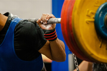 athlete powerlifter preparing squat exercise at powerlifting competition