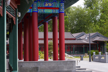 Japanese garden, Chinese houses and buildings in a park with a pond. Summer gazebos in the park