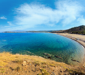 Summer sea top view with Trani Ammouda beach (Ormos Panagias, Halkidiki, Greece). People unrecognizable.