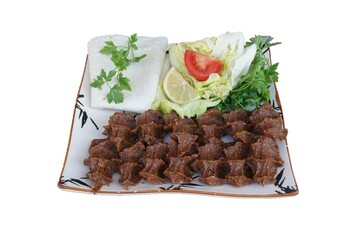 Cig kofte (raw meatball) with lettuce. Turkish traditional food concept.