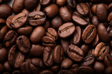 Fototapeta premium Processed collage of dark brown coffee beans texture. Background for banner, backdrop or texture