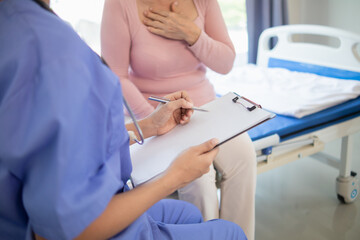 An elderly woman undergoes an annual health examination because she need health examination documents apply for health and life insurance. doctor is examining body of an elderly woman check her health