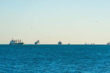Fototapeta premium Many transport ships on blue sea, tanker cargo ships