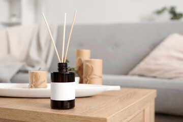 Reed diffuser on table at home, closeup